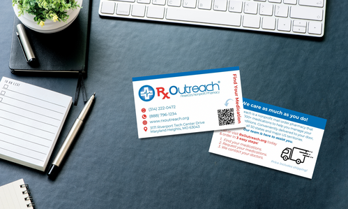 Doubled sided business card for Rx Outreach on a desk. 